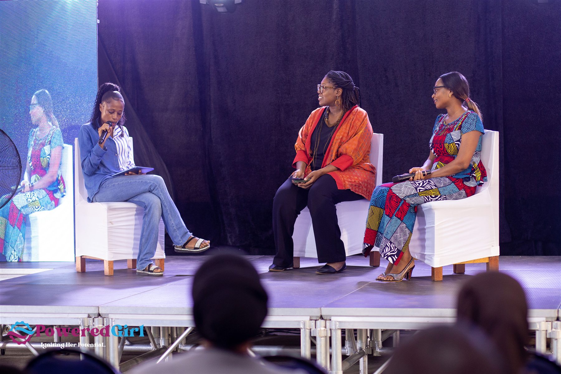 Women leaders sharing insight during a Powered Girl panel conversation