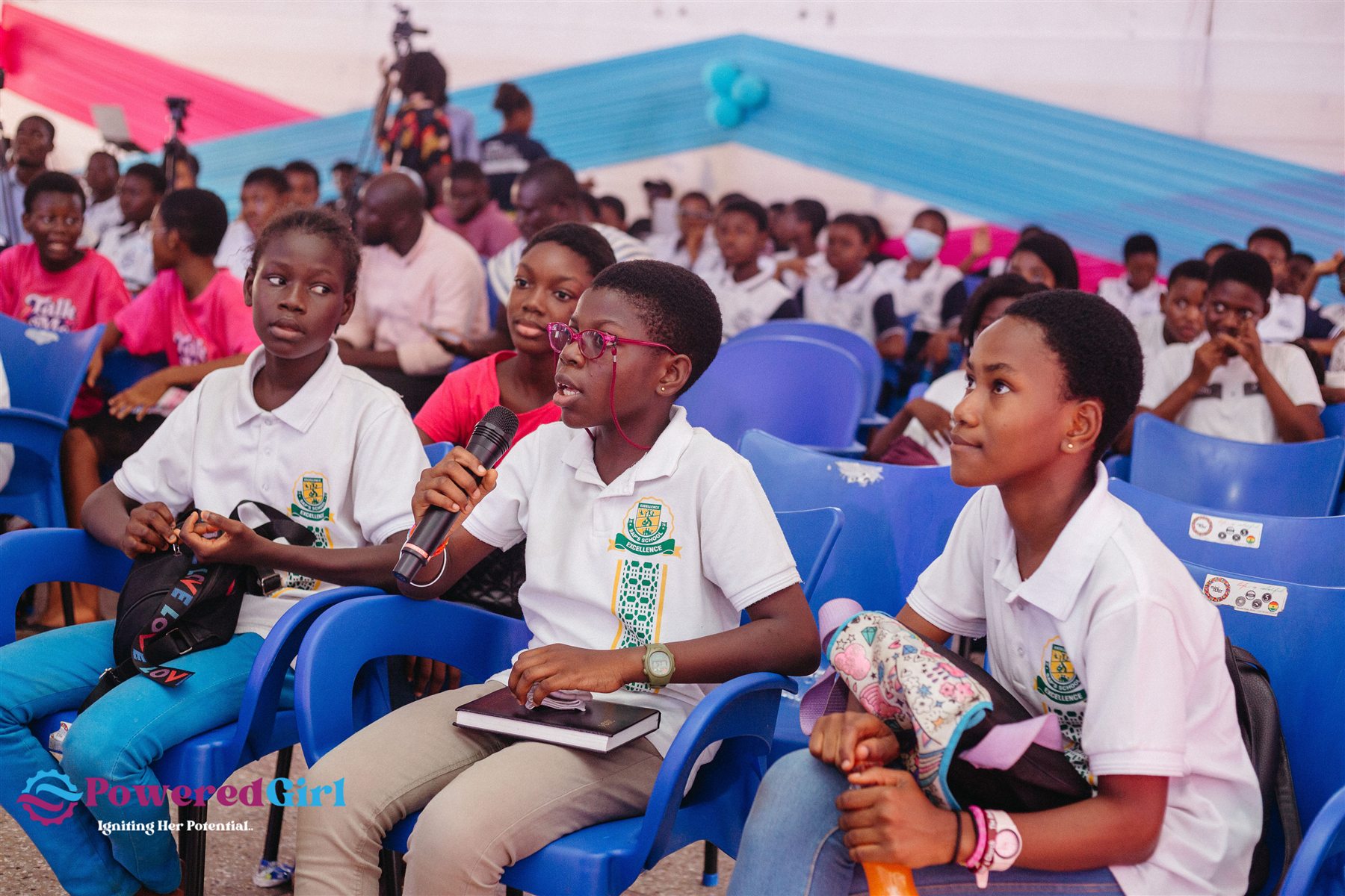 A student asking a question during the Powered Girl Summit
